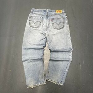 Vintage style modern Levi's 550 light wash essential distressed denim jeans